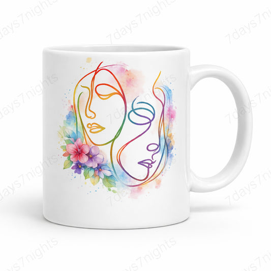 White ceramic mug featuring abstract face line art with colorful floral accents
